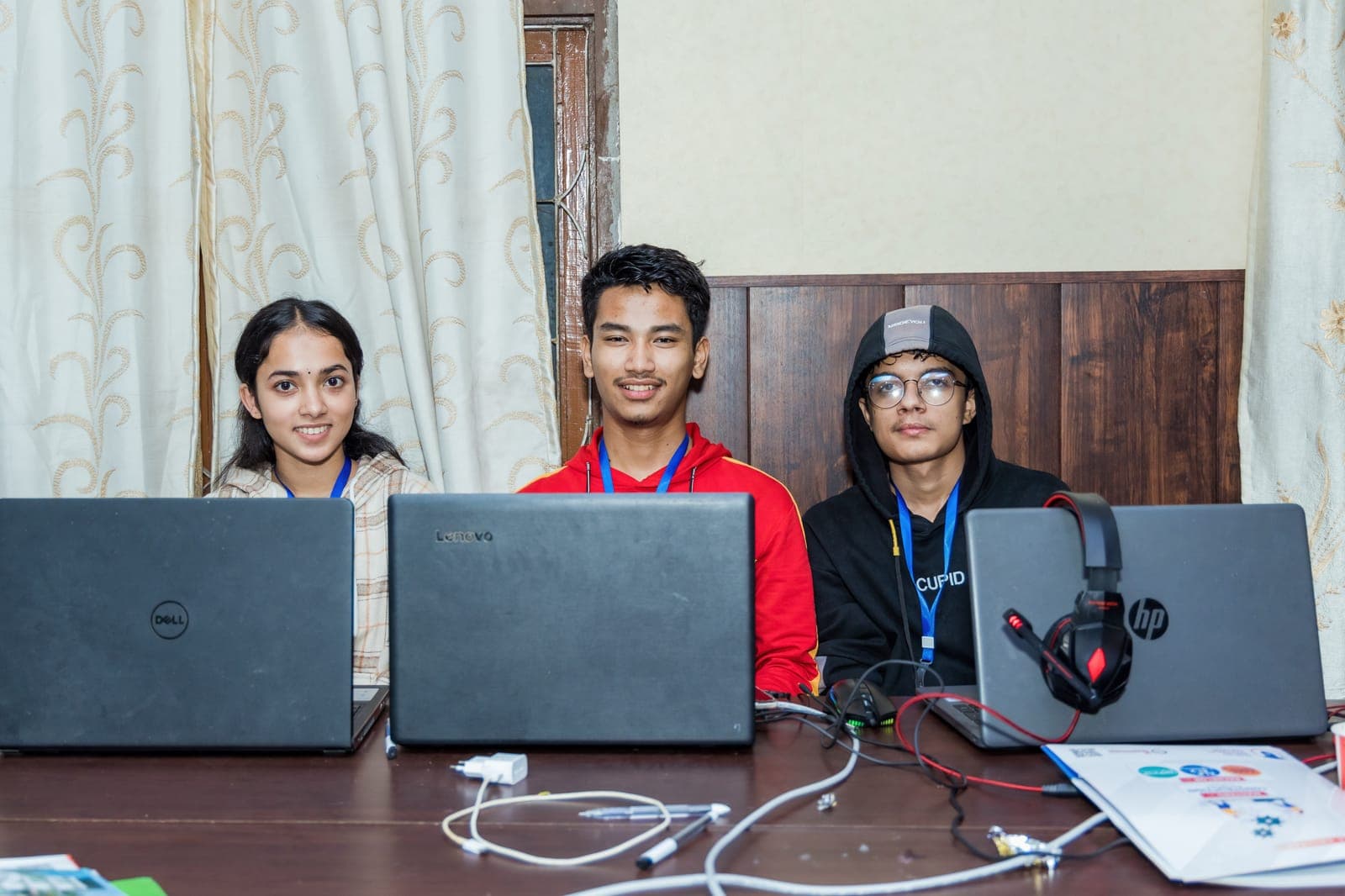 A team at work on their laptops during U-TEC Hackathon Alpha