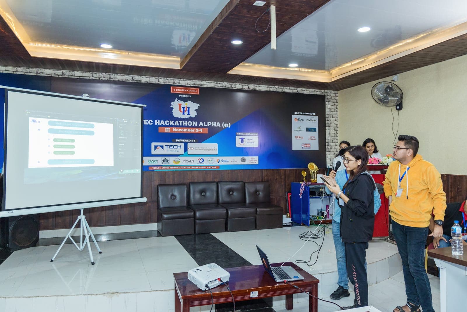 A team presenting their project to the judges at U-TEC Hackathon Alpha