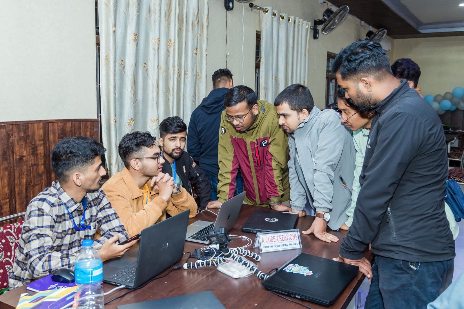 Judges reviewing a team's project at U-TEC Hackathon Alpha