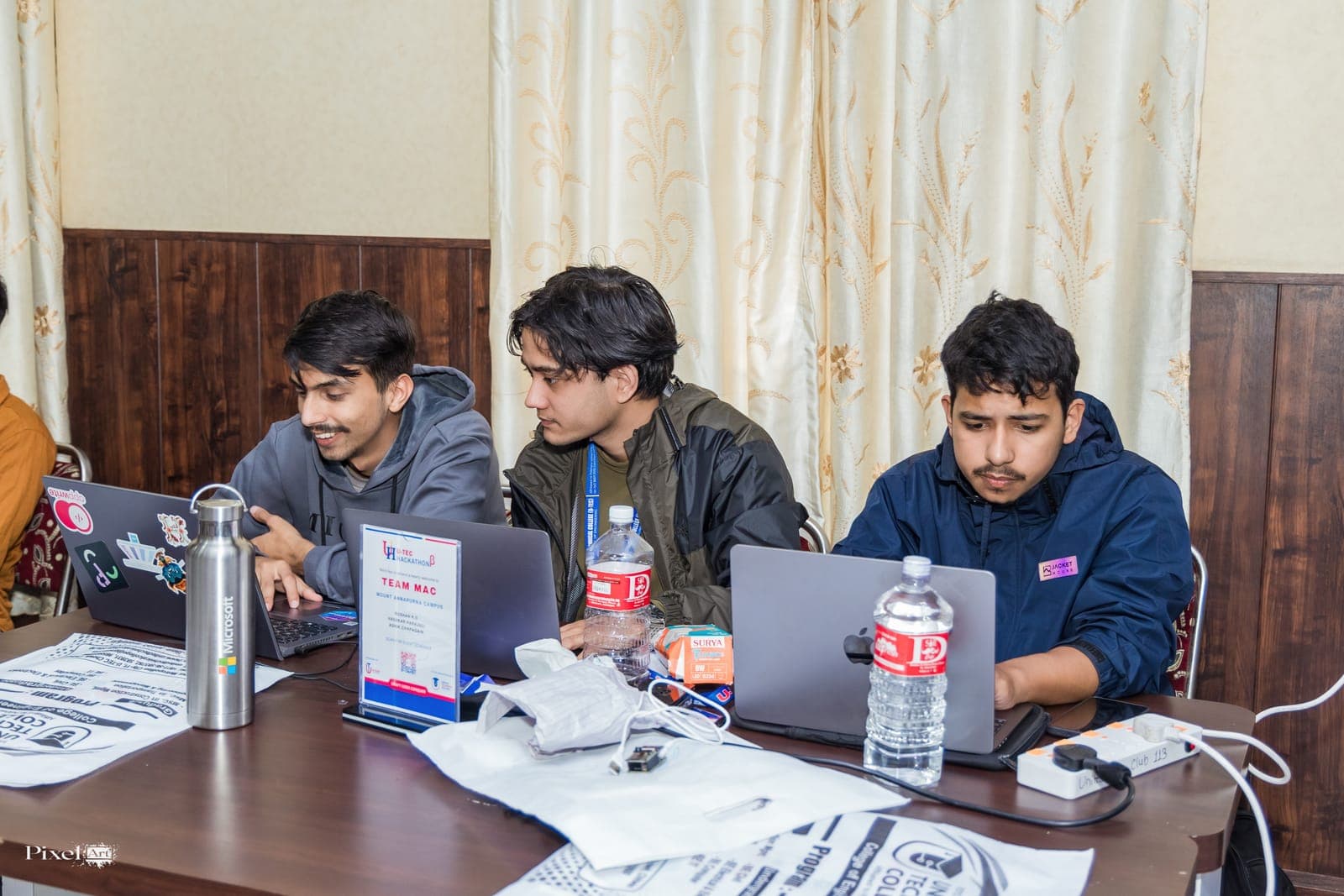 A team coding during U-TEC Hackathon Beta