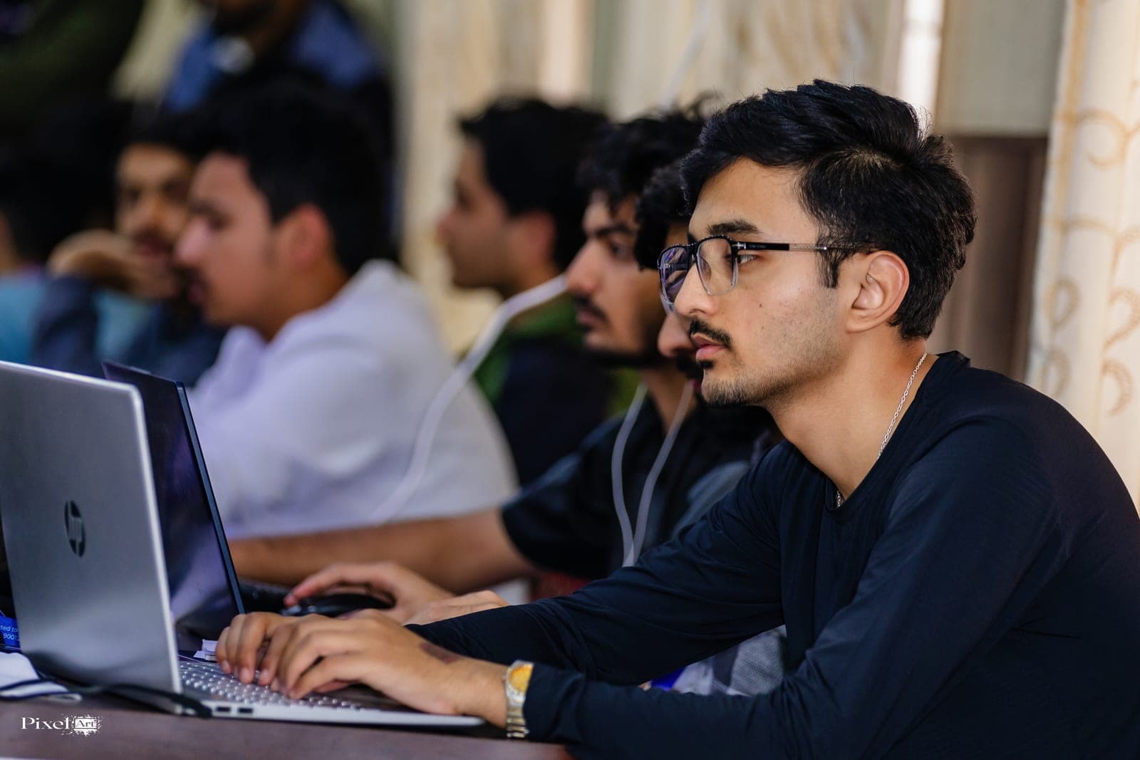 Participants coding during U-TEC Hackathon Beta