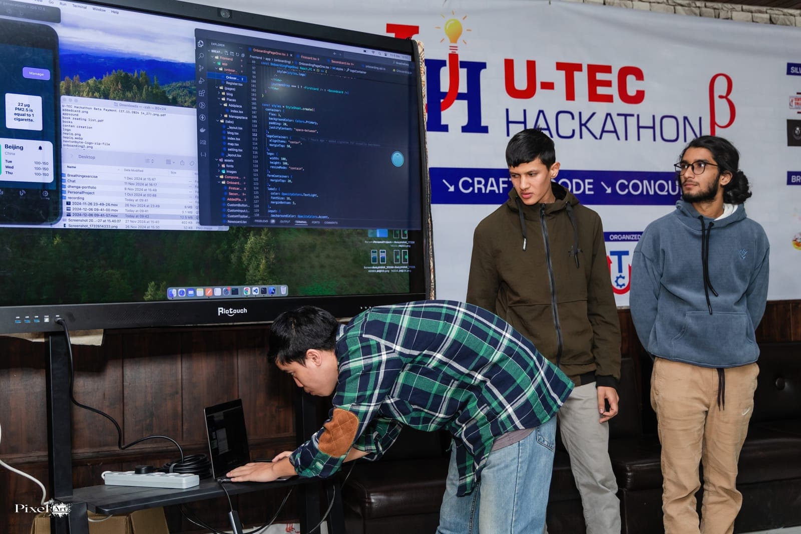 A team demonstrating their project on screen at U-TEC Hackathon Beta