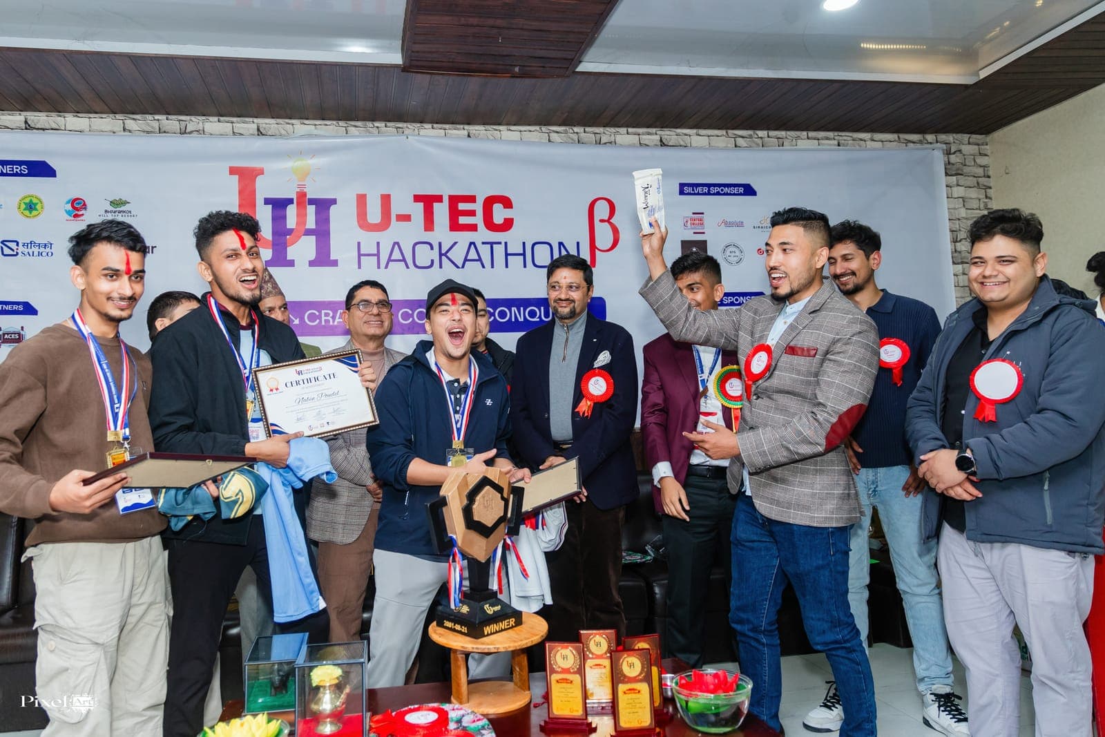 Winners and guests on stage at U-TEC Hackathon Beta