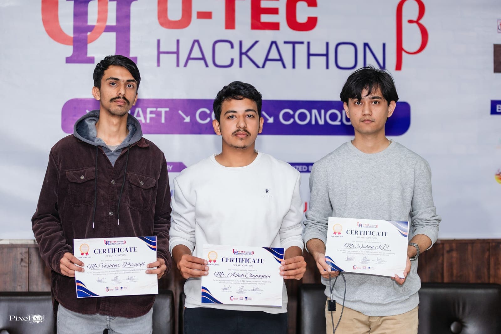 A team presenting with their certificates at U-TEC Hackathon Beta