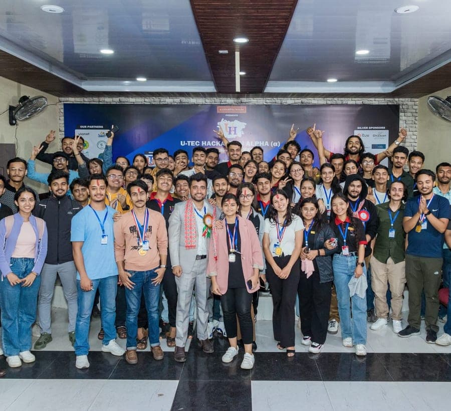 Club members and participants posing together at a hackathon